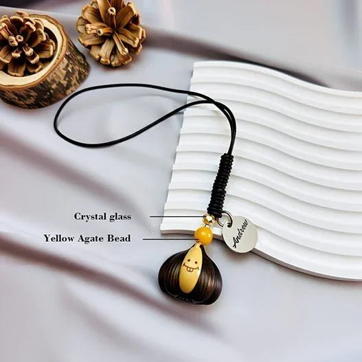 Close-up of the natural grain of Agarwood beads and the vibrant optimism of Yellow Agate