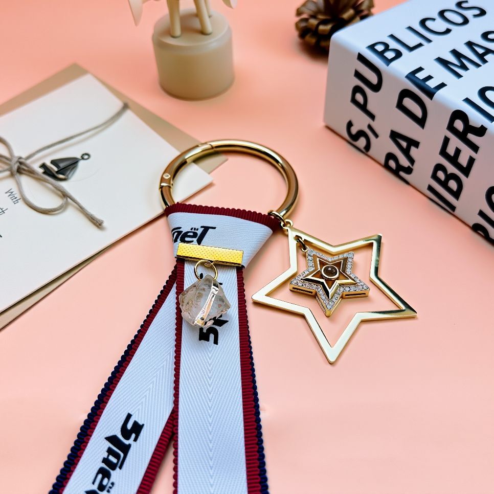 Close-up Shot of Handcrafted Good Luck Ribbon Bag Charm Featuring Natural Citrine Bead, Unique Personalized Feng Shui Accessory for Bags and Backpacks