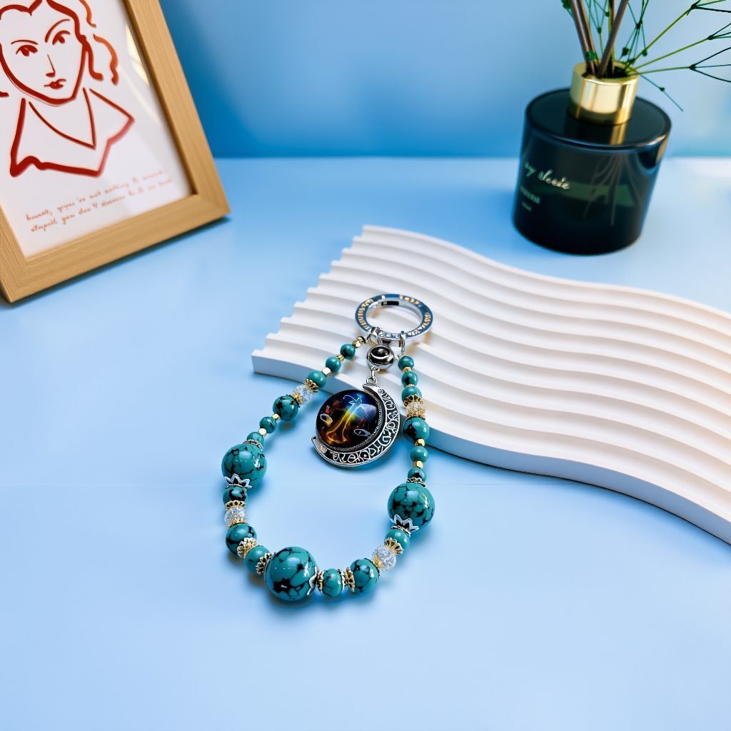 Personalized zodiac energy bag charm with turquoise beads and custom photo pendant, handcrafted spiritual accessory for luck and protection