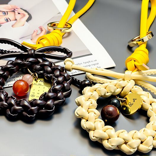 Side-by-side couple wreath bag charms—cream with Tiger’s Eye & Obsidian, dark with Red Agate & Rose Quartz, personalized gold tag (bagcharms)