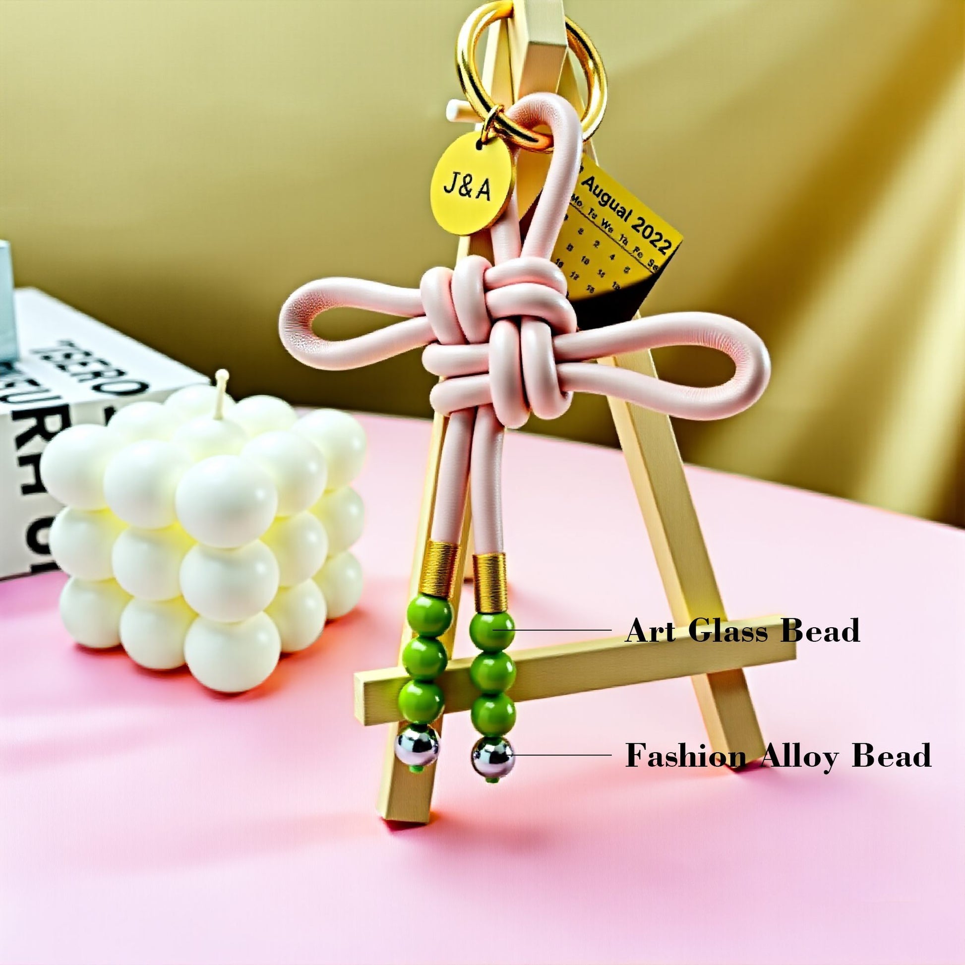 Handwoven leather love knot bag pendant with art glass beads and fashion alloy beads, custom couple gift keychain, personalized romantic accessory, love and connection collection, stylish handmade bag charm