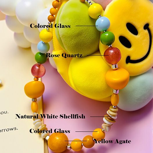 Smiley sunflower plush bag charm close-up with beaded strap—rose quartz, yellow agate, colored glass and natural white shell (bagcharms)
