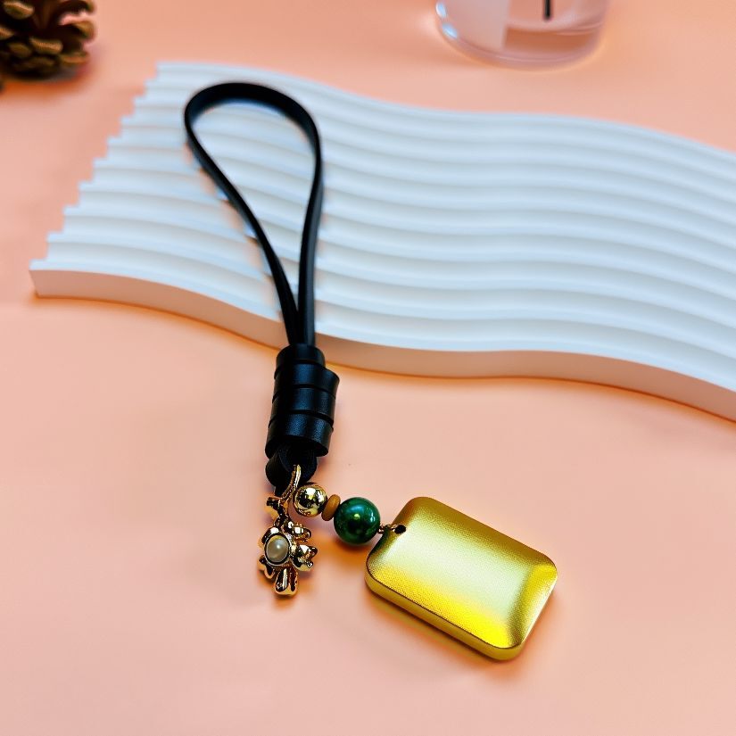 Handcrafted peace and safety bag charm featuring solid brass pendant, green agate bead, and durable titanium steel accents, perfect for luck and protection accessories