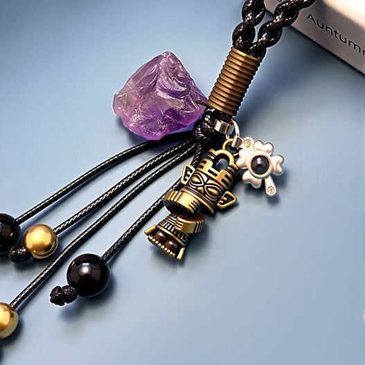 Amethyst and bronze totem detail on travel souvenir bag charm with obsidian and copper bead tassels—grounding protection (bagcharms)