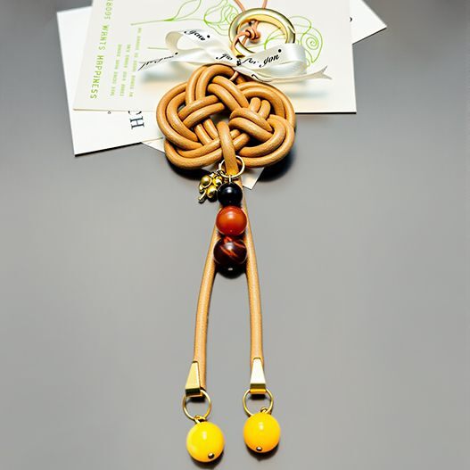 Hand-braided Full-grain Leather Promise Knot Bag Charm with custom photo projection and natural gemstones