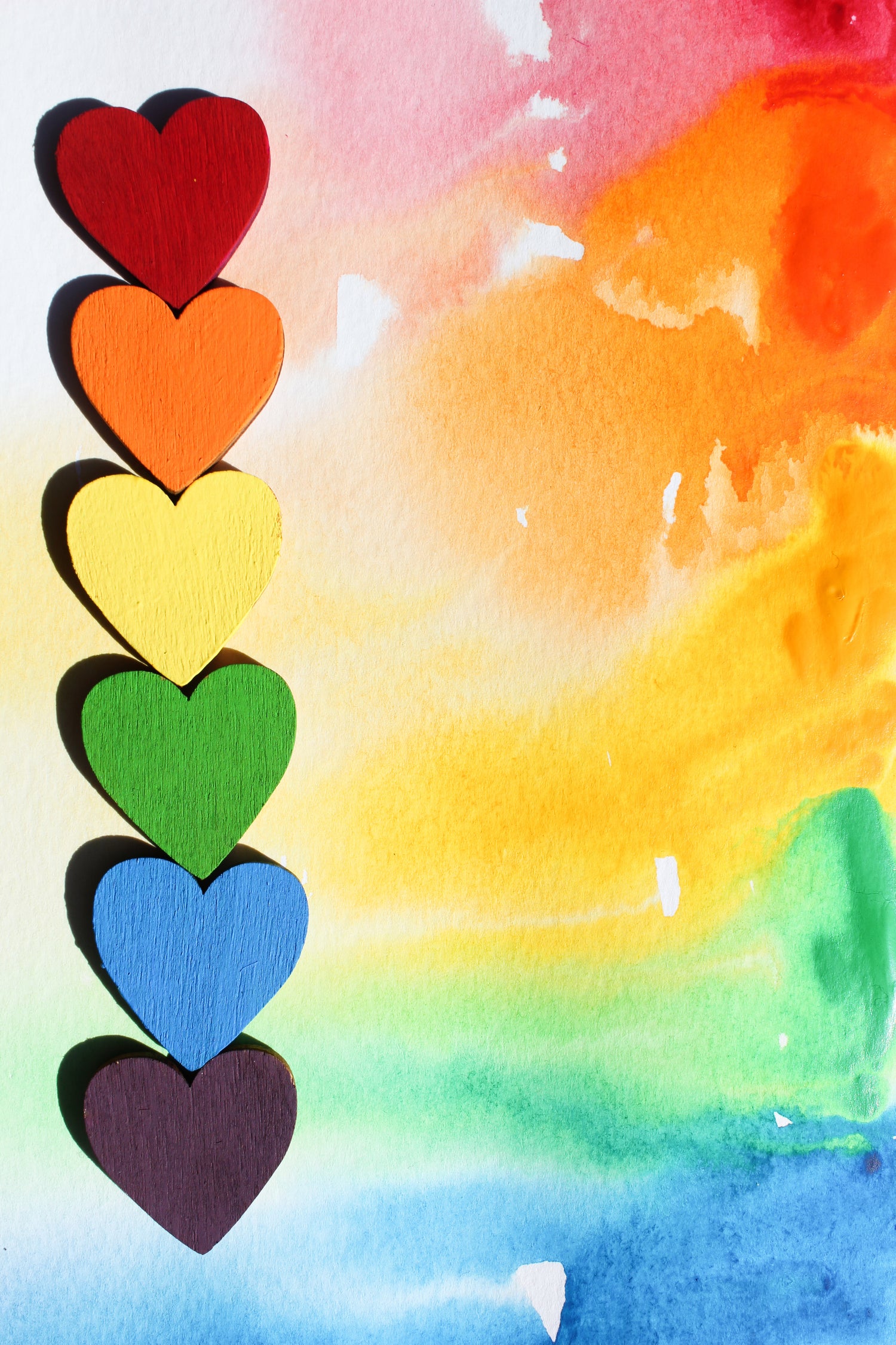 Bondora Fortuna brand values: Rainbow hearts on canvas representing love, inclusivity, and emotional connection.