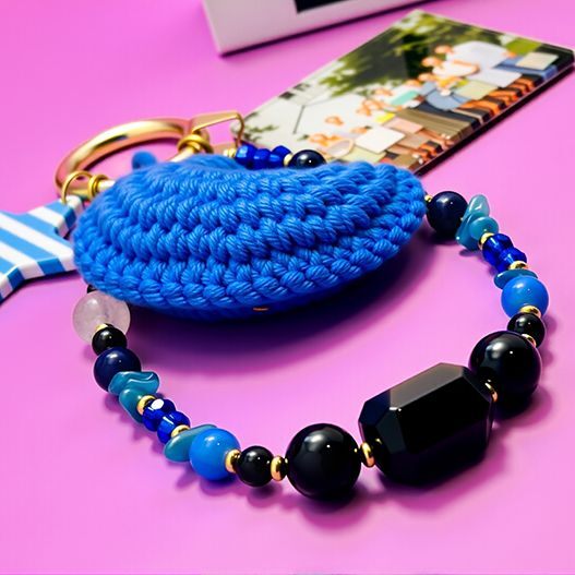 Hand-crocheted blue moon texture close-up with gemstone strap—lapis lazuli, kyanite, obsidian—and custom photo card attachment (bagcharms)