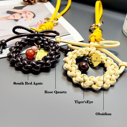 Close-up of the South Red Agate, Rose Quartz, and Tiger's Eye beads integrated into the braided leather wreath.