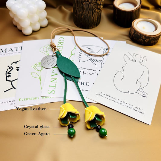 Close view of finished leather tulip charm highlighting vegan leather, crystal-glass accents, and green agate beads.