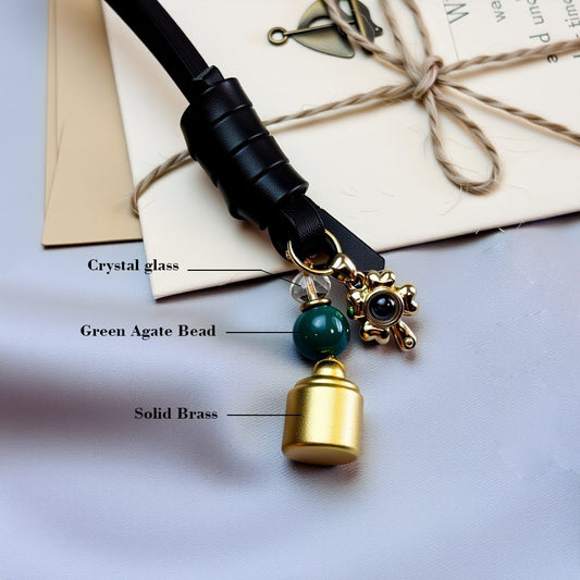 Material details of brass Good Fortune bag charm with green agate bead, crystal glass, and solid brass components, handcrafted feng shui accessory