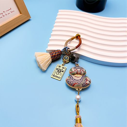 Luxury handmade Scorpio zodiac bag charm with Song brocade embroidery and tassel, astrology-inspired accessory for spiritual protection and luck.